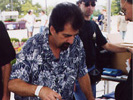 Daniel Pecchio signing an old promo.